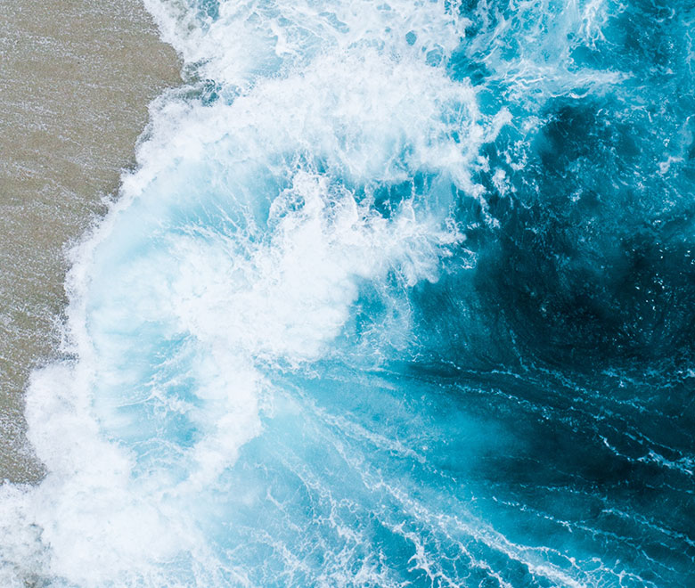 Image of wave crashing on beach
